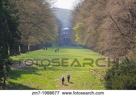 Visitors of Gibside Hall walking down the tree lined walk towards the Chapel. National Trust. View Large Photo Image Stock Photo - Visitors of Gibside Hall walking down the tree lined walk towards the Chapel. National Trust.. Fotosearch