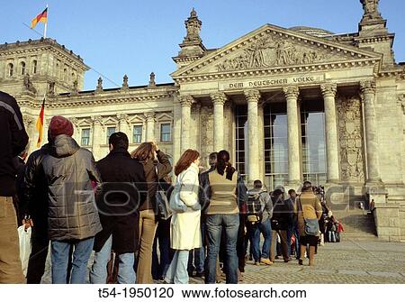 Stock Image - Visitors queue outside the German Bundestag in Berlin. Fotosearch