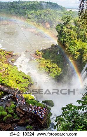 Visitors standing at the Bosetti Waterfall observation deck. Iguaz National Park, Argentina. View Large Photo Image Picture - Visitors standing at the Bosetti Waterfall observation deck. Iguaz National Park, Argentina.. Fotosearch
