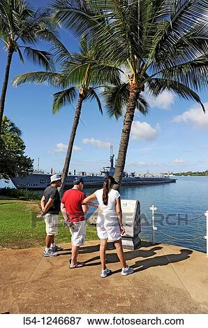 Visitors to Pearl Harbor Pacific National Monument Hawaii look at USS Bowfin Submarine on display View Large Photo Image Stock Photo - Visitors to Pearl Harbor Pacific National Monument Hawaii look at USS Bowfin Submarine on display. Fotosearch