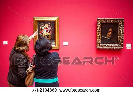 visitors watching a painting. At left `vase? by Juan Van Der Hamen. At right `Self portrait? by Diego Velazquez (1599-1660). Museum of Fine Arts. Valencia, Spain. View Large Photo Image Stock Photo - visitors watching a painting. At left `vase? by Juan Van Der Hamen. At right `Self portrait? by Diego Velazquez (1599-1660). Museum of Fine Arts. Valencia, Spain.. Fotosearch