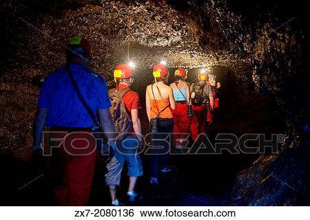 Stock Photograph - Visits to the underground caves created by lava in the Grand Br? l? area, also called lavatubes.. Fotosearch