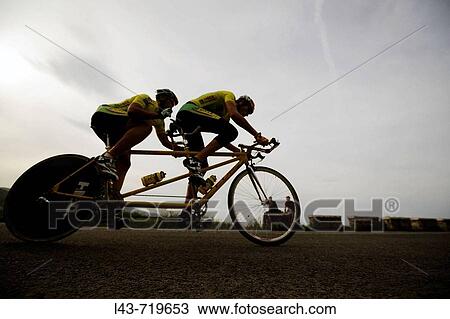 Visually-impaired cyclist racing on tandem bike with partner View Large Photo Image Stock Image - Visually-impaired cyclist racing on tandem bike with partner. Fotosearch