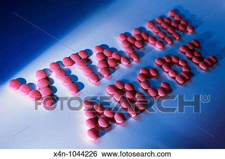 Stock Photograph - Vitamin pills spelling out the word vitamin and abcde. Fotosearch