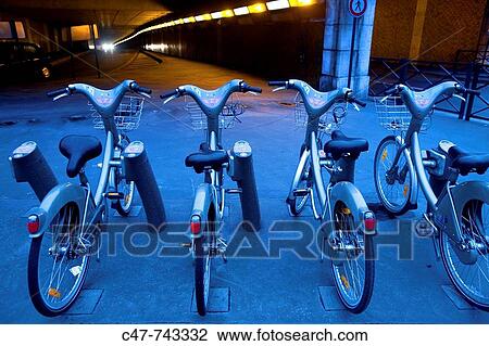 Stock Image - V'lib (? v? lo libre? or? v? lo libert??, English: free bicycle or bicycle freedom) is a public bicycle rental programme in Paris, France.. Fotosearch