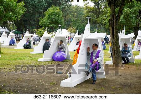 Vocations event where hundreds of catholic missionary organizations from around the world had set up stands in tents to show their wares and interest the the youth. It rained all day... confessionals en masse. View Large Photo Image Stock Photo - Vocations event where hundreds of catholic missionary organizations from around the world had set up stands in tents to show their wares and interest the the youth. It rained all day... confessionals en masse.. Fotosearch