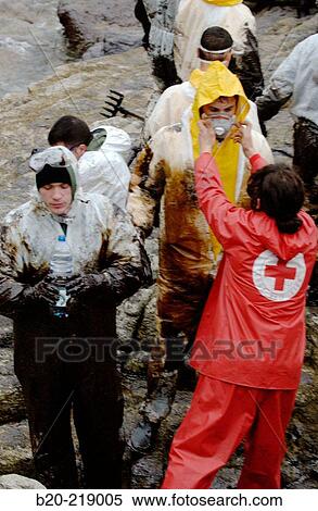 Volunteers dressed with protective clothing gathering the fuel spill (? chapapote? ) of Prestige tanker. Dec. 2002. Galicia. Spain View Large Photo Image Stock Photography - Volunteers dressed with protective clothing gathering the fuel spill (? chapapote? ) of Prestige tanker. Dec. 2002. Galicia. Spain. Fotosearch