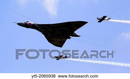 Vulcan XH558 escorted by the RV8ters stunt team the at RAF Cosford Airshow 2012, Shropshire, England, Europe. View Large Photo Image Stock Photo - Vulcan XH558 escorted by the RV8ters stunt team the at RAF Cosford Airshow 2012, Shropshire, England, Europe.. Fotosearch