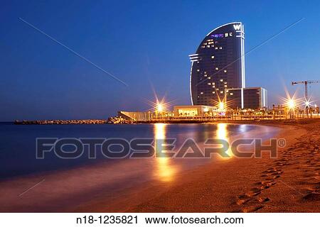 Stock Image - W Barcelona hotel (also known as Vela Hotel) by architect Ricard Bofill, Barceloneta neighborhood, Barcelona, Catalonia, Spain. Fotosearch
