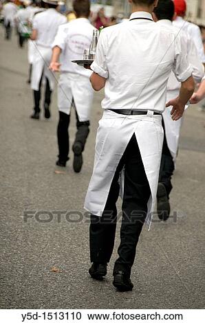 Stock Image - waiters race with trays on street of Geneve, Switzerland. Fotosearch