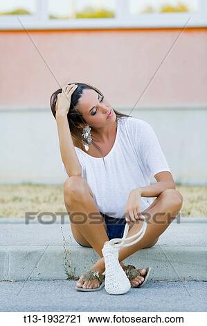 Waiting on the edge of the road young woman View Large Photo Image Stock Image - Waiting on the edge of the road young woman. Fotosearch