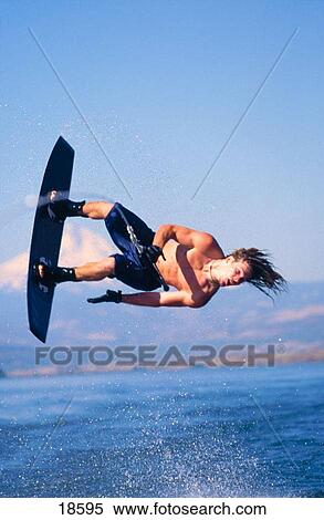 Wakeboarder doing a back roll on the Columbia River, Oregon View Large Photo Image Stock Photography - Wakeboarder doing a back roll on the Columbia River, Oregon. Fotosearch