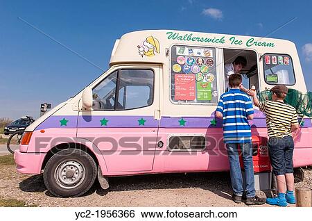 Walberswick, Suffolk, UK. 6th May 2013. Two boys enjoy the sunny weather on Bank Holiday Monday 6th of May 2013 as they buy ice creams at Walberswick, Suffolk, England, Britain, Uk. View Large Photo Image Stock Photograph - Walberswick, Suffolk, UK. 6th May 2013. Two boys enjoy the sunny weather on Bank Holiday Monday 6th of May 2013 as they buy ice creams at Walberswick, Suffolk, England, Britain, Uk.. Fotosearch