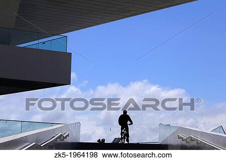 Walk cyclist and the Veles Vent, port of Valencia, Spain. View Large Photo Image Stock Photo - Walk cyclist and the Veles Vent, port of Valencia, Spain.. Fotosearch