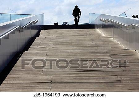 Walk cyclist and the Veles Vent, port of Valencia. View Large Photo Image Stock Photo - Walk cyclist and the Veles Vent, port of Valencia.. Fotosearch