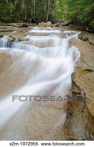 Stock Photography - Walker Cascades during the spring months. These cascades are located along Walker Brook in Franconia Notch State Park of the White Mountain National Forest, New Hampshire.. Fotosearch