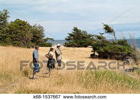 Stock Photo - walkers at Helliwell Park, Hornby Island, Gulf Islands, BC, Canada. Fotosearch