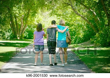 walking along a tree lined path View Large Photo Image Stock Image - walking along a tree lined path. Fotosearch