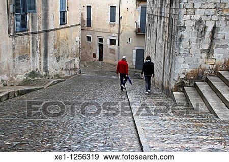 Walking by the streets of Girona, Catalonia, Spain.. View Large Photo Image Stock Photo - Walking by the streets of Girona, Catalonia, Spain... Fotosearch