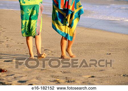 Walking on the beach View Large Photo Image Stock Image - Walking on the beach. Fotosearch