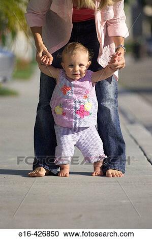 walking toddler with mother's help View Large Photo Image Stock Image - walking toddler with mother's help. Fotosearch