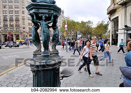 Wallace fountain. Designed by Charles-Auguste Lebourg. Financed by Richard Wallace. Intersection Gran Via with Passeig de Gr? cia. It's one of the 2 remaining of the 12 fountains donated to Barcelona for the 1888 World Fair. Barcelona. Catalonia. Spain. View Large Photo Image Picture - Wallace fountain. Designed by Charles-Auguste Lebourg. Financed by Richard Wallace. Intersection Gran Via with Passeig de Gr? cia. It's one of the 2 remaining of the 12 fountains donated to Barcelona for the 1888 World Fair. Barcelona. Catalonia. Spain.. Fotosearch