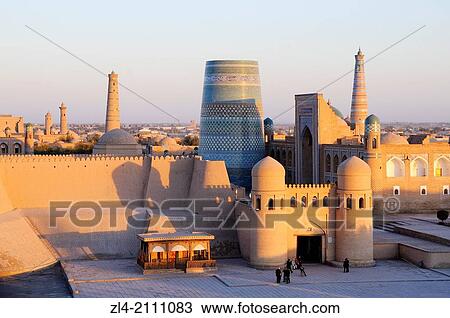 Walled city of Khiva viewed from the West Gate in the evening. Uzbekistan, Khorezm, Khiva, Itchan Kala (inner town). View Large Photo Image Stock Image - Walled city of Khiva viewed from the West Gate in the evening. Uzbekistan, Khorezm, Khiva, Itchan Kala (inner town).. Fotosearch