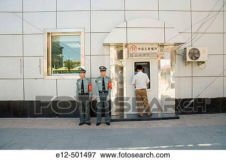 Stock Photo - Wang Fu Jing road, people passing by, cash teller, policemen. Beijing. China.. Fotosearch