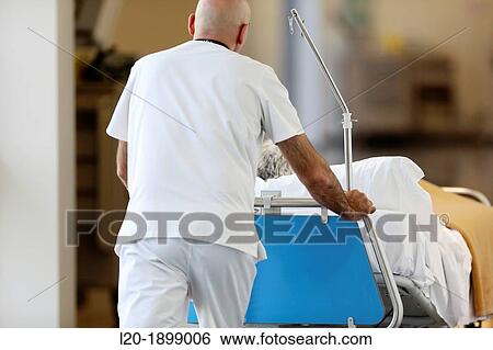 Warden moving patient, Onkologikoa Hospital, Oncology Institute, Case Center for prevention, diagnosis and treatment of cancer, Donostia, San Sebastian, Gipuzkoa, Basque Country, Spain View Large Photo Image Stock Photograph - Warden moving patient, Onkologikoa Hospital, Oncology Institute, Case Center for prevention, diagnosis and treatment of cancer, Donostia, San Sebastian, Gipuzkoa, Basque Country, Spain. Fotosearch