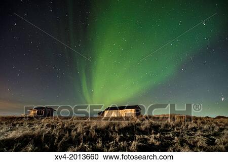 Warehouse with Aurora Borealis background, Northern lights in winter. Southern Iceland. View Large Photo Image Stock Image - Warehouse with Aurora Borealis background, Northern lights in winter. Southern Iceland.. Fotosearch