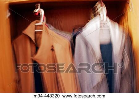 Stock Image - Warm clothes in wardrobe. Fotosearch