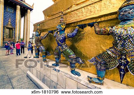 Stock Photograph - Warriors statues Wat Phra Kaew or Temple of the Emerald Buddha Grand Palace Bangkok, Thailand. Fotosearch