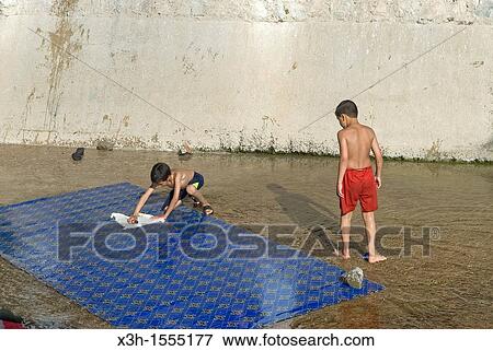 Stock Photo - wash house on the Ras-el-Maa river, Chefchaouen, Rif region, Morocco, North Africa. Fotosearch