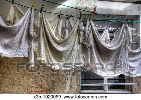 Wash linens in a courtyard of Madrid, Spain View Large Photo Image Stock Photo - Wash linens in a courtyard of Madrid, Spain. Fotosearch