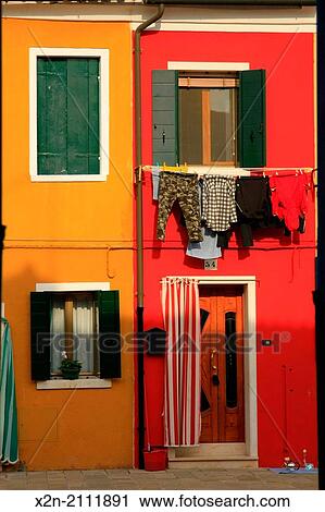 Washed clothes hanging and Colored buildings. Burano. Venice. Veneto. Italy. View Large Photo Image Stock Image - Washed clothes hanging and Colored buildings. Burano. Venice. Veneto. Italy.. Fotosearch