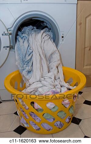 washing being put in basket from washing machine View Large Photo Image Stock Image - washing being put in basket from washing machine. Fotosearch