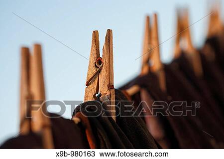 Washing line and clothes pegs in the morning light View Large Photo Image Stock Image - Washing line and clothes pegs in the morning light. Fotosearch