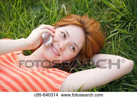 Picture - Washington, DC, USA, Portrait of a woman, with cell phone and laptop, Adult, 23 years old, Asian. Fotosearch