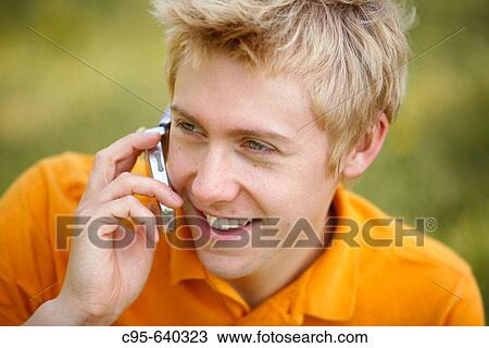 Washington, DC, USA, Portrait of a young man, with cell phone, volleyball and tennis, Adult, 23 years old View Large Photo Image Stock Image - Washington, DC, USA, Portrait of a young man, with cell phone, volleyball and tennis, Adult, 23 years old. Fotosearch