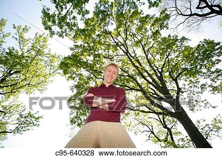 Washington, DC, USA, Portrait of a young man, with cell phone, volleyball and tennis, Adult, 23 years old. View Large Photo Image Stock Photo - Washington, DC, USA, Portrait of a young man, with cell phone, volleyball and tennis, Adult, 23 years old.. Fotosearch