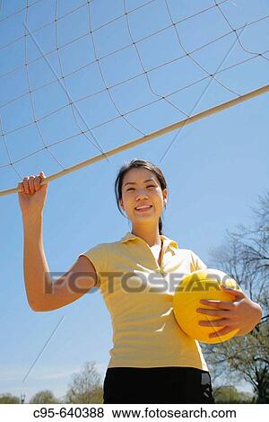 Stock Photo - Washington, DC, USA, Portrait of a woman, stretching, tennis, volleyball, 23 years old.. Fotosearch