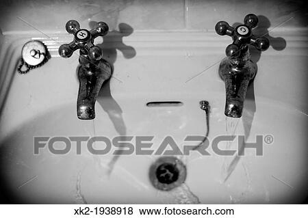 Stock Photo - Waste, Old Tap in an english house. Fotosearch