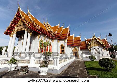 Stock Photo - Wat Benchamabophit Dusitvanaram is also known as the marble temple and one of Bangkok's most beautiful temples typifying the ornate Thai style of gables, step roofs and elaborate details. Fotosearch