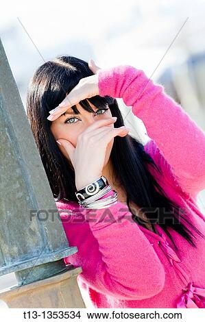Picture - Watchful eyes, attractive young woman. Fotosearch