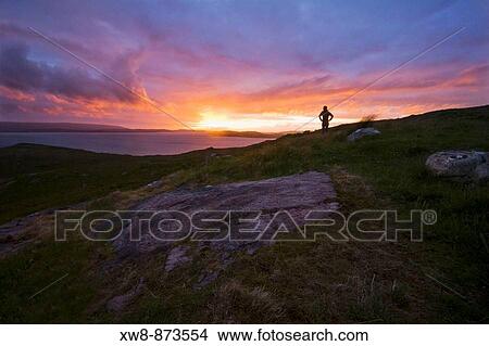 Watching the sunset over Loch Ewe near Poolewe, Scotland View Large Photo Image Picture - Watching the sunset over Loch Ewe near Poolewe, Scotland. Fotosearch