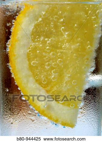 Water glass with lemon View Large Photo Image Stock Photography - Water glass with lemon. Fotosearch
