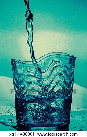 Water glass, with water pouring View Large Photo Image Stock Image - Water glass, with water pouring. Fotosearch