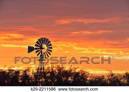 Water pumping windmill at dawn on Campos Viejos Ranch, Rio Grande City, Texas, USA. View Large Photo Image Stock Photograph - Water pumping windmill at dawn on Campos Viejos Ranch, Rio Grande City, Texas, USA.. Fotosearch