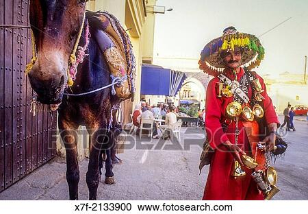 water seller in their traditional colourful costume, Medina, UNESCO World Heritage Site, Fez, Morocco, Africa. View Large Photo Image Stock Image - water seller in their traditional colourful costume, Medina, UNESCO World Heritage Site, Fez, Morocco, Africa.. Fotosearch