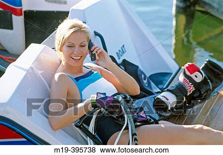 water skiing woman on cell phone View Large Photo Image Stock Photo - water skiing woman on cell phone. Fotosearch